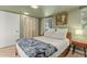 Comfortable bedroom featuring soft lighting, a decorative blanket, and a closet at 1326 E Almeria Rd, Phoenix, AZ 85006