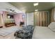 This bedroom features a unique accent wall, ceiling fan, spacious layout and modern decor elements at 1326 E Almeria Rd, Phoenix, AZ 85006