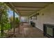 This covered patio offers a view of the backyard, featuring black metal furniture and ample space at 1326 E Almeria Rd, Phoenix, AZ 85006