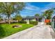 Attractive single-story home with a well-maintained lawn and mature trees on a sunny day at 1326 E Almeria Rd, Phoenix, AZ 85006