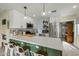 A bright modern kitchen with white cabinets, stainless appliances, and breakfast bar at 1326 E Almeria Rd, Phoenix, AZ 85006