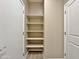Closet with multiple shelves for ample storage, and doorways for easy access at 15422 S Sequoia Cir, Arizona City, AZ 85123