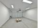 Spacious two car garage with ample lighting, garage door, and room for storage at 15422 S Sequoia Cir, Arizona City, AZ 85123