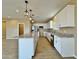 Well-lit kitchen featuring an island, stainless steel appliances, granite countertops, and ample cabinet space at 15422 S Sequoia Cir, Arizona City, AZ 85123