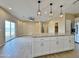 Modern kitchen with an island, granite countertops, stainless steel appliances and an open layout at 15422 S Sequoia Cir, Arizona City, AZ 85123