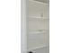 White pantry shelving offers ample storage space for dry goods and kitchen essentials at 15422 S Sequoia Cir, Arizona City, AZ 85123