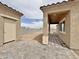 View of the covered patio with stone pavers and a stucco shed at 15422 S Sequoia Cir, Arizona City, AZ 85123