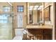 Bathroom boasts a glass enclosed shower and vanity with granite countertop at 15956 E Tombstone Trl, Fountain Hills, AZ 85268