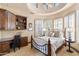 Comfortable bedroom featuring a desk, built-in shelving, and plenty of natural light at 15956 E Tombstone Trl, Fountain Hills, AZ 85268