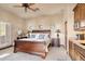 Bedroom with wood trim and cabinetry plus abundant natural light at 15956 E Tombstone Trl, Fountain Hills, AZ 85268