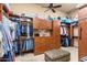 Spacious walk-in closet with custom wood shelving and drawers for ample storage at 15956 E Tombstone Trl, Fountain Hills, AZ 85268