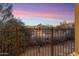 Capture the breathtaking desert views through the wrought iron fence at 15956 E Tombstone Trl, Fountain Hills, AZ 85268
