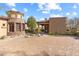 Exterior of house with a brick driveway, stone accents, barrel roof, and desert landscaping at 15956 E Tombstone Trl, Fountain Hills, AZ 85268