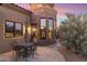 Inviting outdoor patio with stone accents and desert landscaping offers a charming space for relaxation and entertainment at 15956 E Tombstone Trl, Fountain Hills, AZ 85268