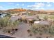 Beautiful home with manicured landscaping, a circular driveway, and a well-maintained exterior in a golf course community at 15956 E Tombstone Trl, Fountain Hills, AZ 85268