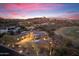 Gorgeous exterior view of desert home near golf course in beautiful community with a colorful Arizona sunset at 15956 E Tombstone Trl, Fountain Hills, AZ 85268