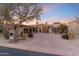 Stunning desert home featuring a brick driveway, lush landscaping, and a private two-car garage at 15956 E Tombstone Trl, Fountain Hills, AZ 85268