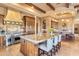 Spacious kitchen with a large island, stainless steel appliances, and custom cabinetry at 15956 E Tombstone Trl, Fountain Hills, AZ 85268