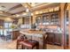 Gourmet kitchen featuring granite countertops, custom cabinetry, and a breakfast bar at 15956 E Tombstone Trl, Fountain Hills, AZ 85268
