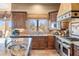 Well-appointed kitchen with stone countertops, tile backsplash, and stainless steel appliances at 15956 E Tombstone Trl, Fountain Hills, AZ 85268
