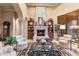 Spacious living area featuring a fireplace, large windows, and comfortable seating arrangement at 15956 E Tombstone Trl, Fountain Hills, AZ 85268