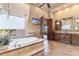 Luxury main bathroom with soaking tub, tile accents, and custom vanities at 15956 E Tombstone Trl, Fountain Hills, AZ 85268