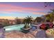 Relax by the pool with comfortable lounge chairs and a captivating view of desert landscaping and picturesque sunsets at 15956 E Tombstone Trl, Fountain Hills, AZ 85268