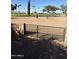 Wrought iron gate and block wall overlooking a pristine golf course at 1630 S Sossaman Rd, Mesa, AZ 85209