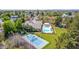 Aerial view of landscaped property with tennis court and pool at 1632 S Alba Cir, Mesa, AZ 85204