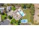 This aerial view displays the full backyard featuring a pool, tennis court, playground, and large grassy area at 1632 S Alba Cir, Mesa, AZ 85204
