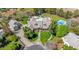 Expansive home featuring an in-ground pool, tennis court, trampoline, large yard, and mature trees at 1632 S Alba Cir, Mesa, AZ 85204