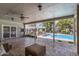 Spacious backyard featuring a covered patio, outdoor kitchen, and swimming pool, perfect for outdoor entertaining at 1632 S Alba Cir, Mesa, AZ 85204