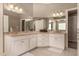 Dual sink bathroom featuring a large mirror, ample counter space, and white cabinetry at 1632 S Alba Cir, Mesa, AZ 85204