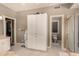 Open bathroom layout with a linen closet and access to the toilet and shower at 1632 S Alba Cir, Mesa, AZ 85204