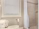Well-lit bathroom featuring a tiled shower and a window with blinds, offering both style and functionality at 1632 S Alba Cir, Mesa, AZ 85204