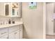 Bathroom with a large sink and counter space leading to a toilet behind a door at 1632 S Alba Cir, Mesa, AZ 85204