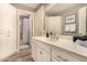 Bathroom with a sink, linen closet, and access to a shower behind a white door at 1632 S Alba Cir, Mesa, AZ 85204