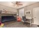 Cozy bedroom with a bunk bed, desk, chair, and window, providing a comfortable and functional space at 1632 S Alba Cir, Mesa, AZ 85204