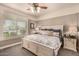 Cozy bedroom featuring a queen bed, side table, and bright window with blinds at 1632 S Alba Cir, Mesa, AZ 85204