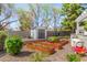 Backyard garden area with a storage shed and raised garden beds filled with various plants at 1632 S Alba Cir, Mesa, AZ 85204