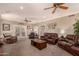 Spacious living room with multiple seating areas and access to outdoor space at 1632 S Alba Cir, Mesa, AZ 85204