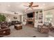 Comfortable living room features a brick fireplace, built-in shelving, and leather seating at 1632 S Alba Cir, Mesa, AZ 85204