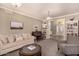 Inviting living room with neutral colors, plush seating, a piano, and natural light at 1632 S Alba Cir, Mesa, AZ 85204