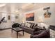 Comfortable living room with sofa, chairs, and entertainment unit for relaxation and entertainment at 1632 S Alba Cir, Mesa, AZ 85204