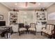 Well-lit home office with built-in bookshelves and comfortable seating at 1632 S Alba Cir, Mesa, AZ 85204