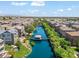 Lovely community featuring a scenic lake, a central pier and bridge, lush trees, and upscale residences at 1679 E Dogwood Ln, Gilbert, AZ 85295