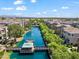 Beautiful aerial view of a community lake with tree lined pathways, homes and a central recreation structure at 1679 E Dogwood Ln, Gilbert, AZ 85295