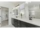 Bathroom featuring double sink vanity with black hardware, and separate shower at 1679 E Dogwood Ln, Gilbert, AZ 85295