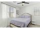 Comfortable bedroom with neutral tones, ceiling fan, and natural light at 1679 E Dogwood Ln, Gilbert, AZ 85295
