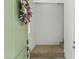 Inviting foyer with a green front door adorned by a floral wreath, offering a warm welcome at 1679 E Dogwood Ln, Gilbert, AZ 85295